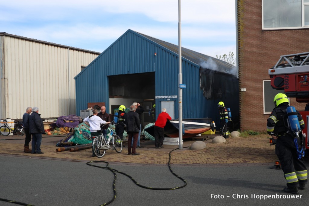 Brand in pand met visnetten
